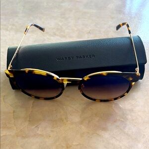Warby Parker tortoise shell sunglasses & case. 
(Daphne)